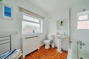 Bathtub, hair dryer, towels