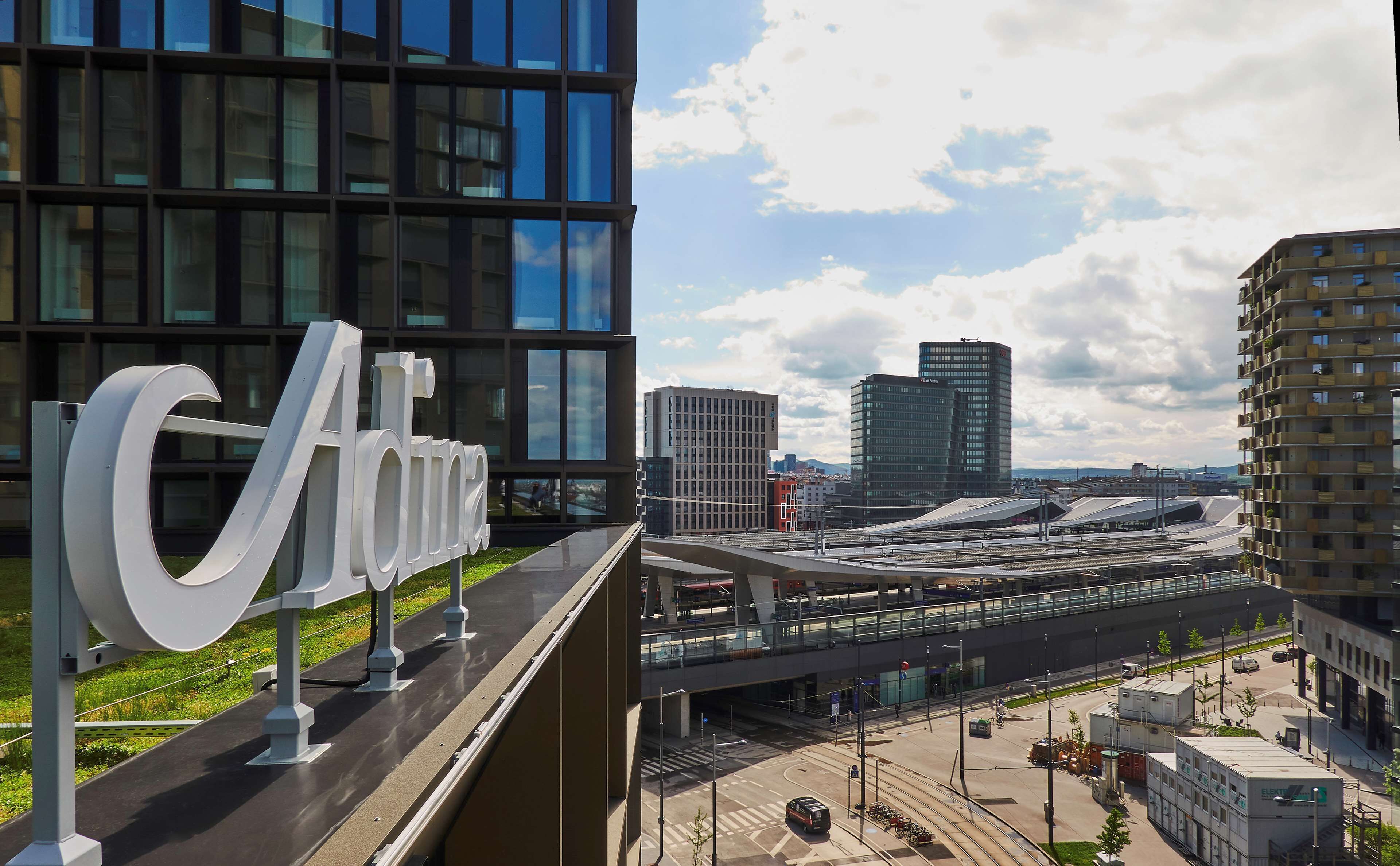 A modern building with a large sign reading "Aldo".