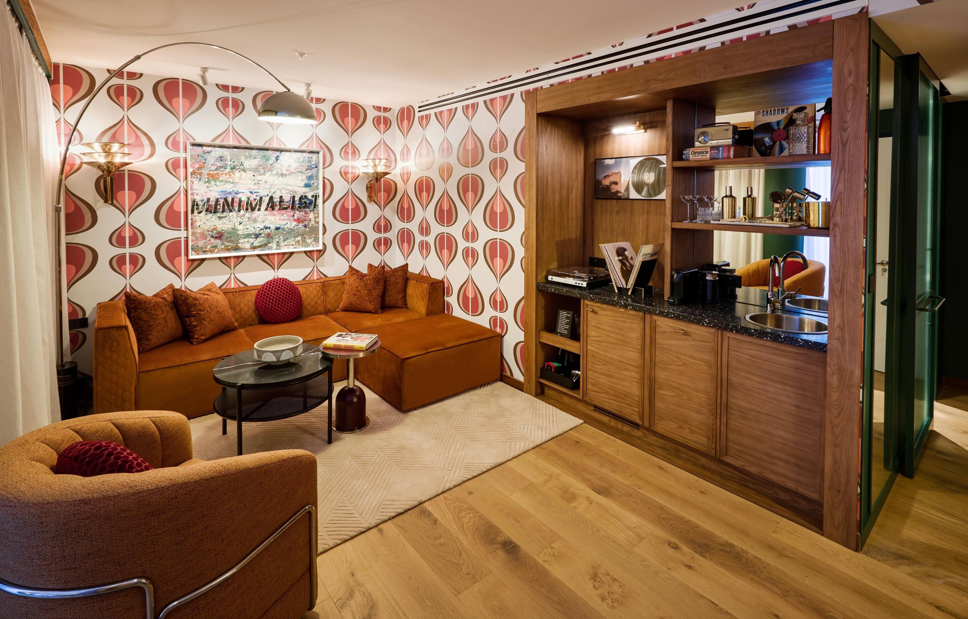A cozy living area with a sofa, a coffee table, and a bookshelf.