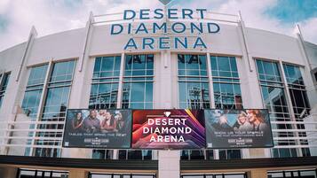 The exterior of the Desert Diamond Arena with large signage and multiple windows.
