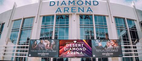 The exterior of the Desert Diamond Arena with large signage and multiple windows.