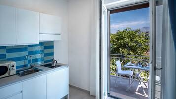 Suíte estúdio | Cozinha privada | Frigobar, micro-ondas, cooktop, máquina de café expresso