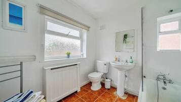 Separate bathtub and shower, deep-soaking bathtub, hair dryer, towels