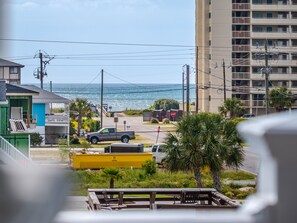Enjoy ocean views from the comfort of this coastal property, featuring a balcony and picnic area.