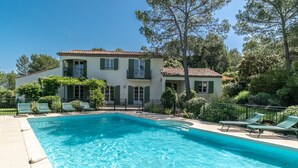 A house with a swimming pool, green shutters, and a balcony. - 5 BEDROOM VILLA WITH PRIVATE POOL AND GARDEN (N°359) (La Motte)