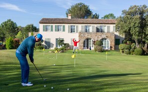 A golf course with a house in the background. - 2 BEDROOM APARTMENT WITH LARGE BALCONY (N°560) (La Motte)