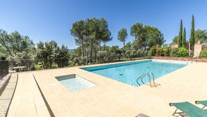 A rectangular swimming pool with a tiled deck, surrounded by trees and a fence. - 3 BEDROOM TOWNHOUSE WITH GARDEN (N°528) (La Motte)