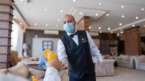 A hotel lobby with a reception area, seating, and a large window. - Rest Night Serviced Apartments - AL Nafal رست نايت للشقق المخدومة - النفل (Riyadh)