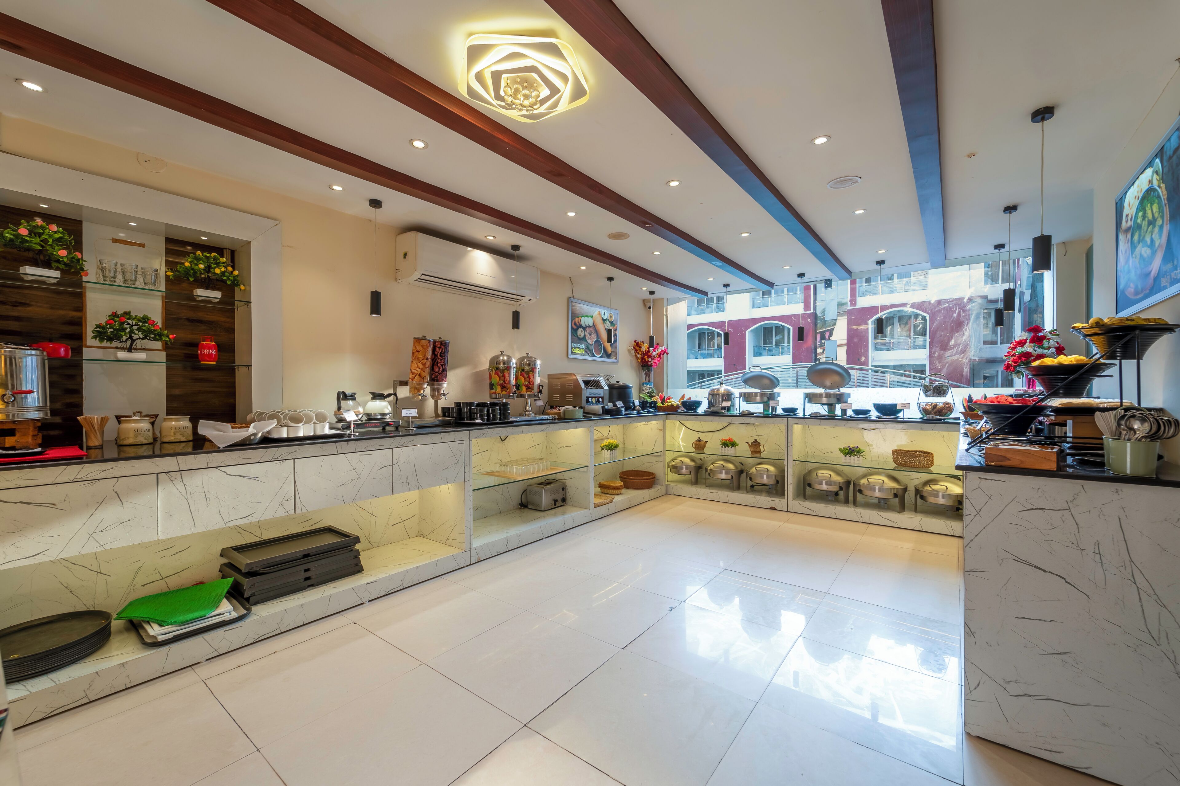A spacious hotel lobby with a marble reception desk, modern lighting, and a view of the cityscape.