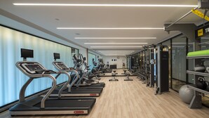 A modern gym with treadmills, weight machines, and exercise balls. - Hilton Garden Inn Changchun Economic Development Zone (Changchun)