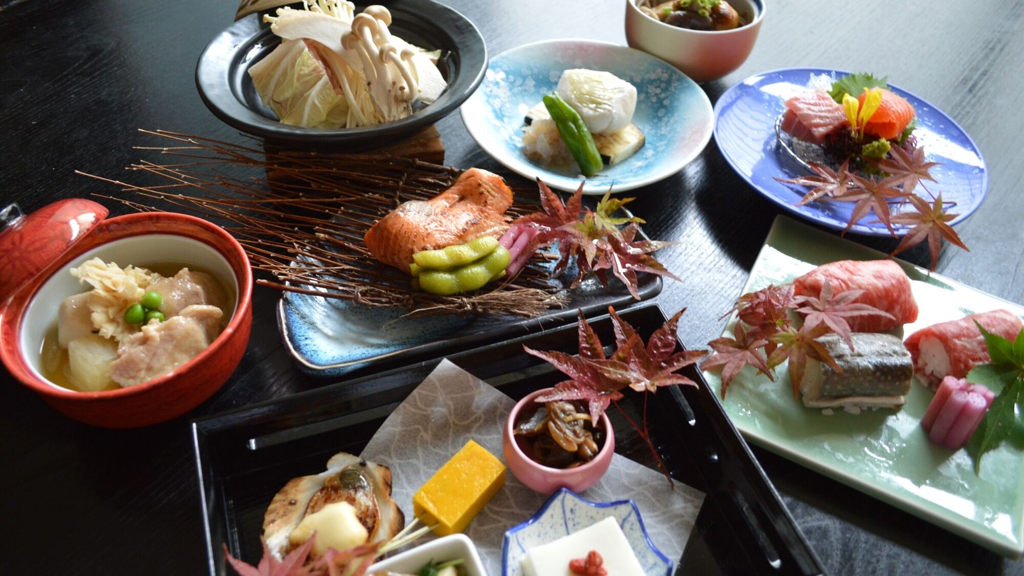 A variety of Japanese dishes on a table.