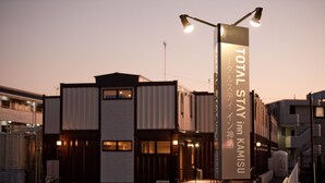 A building with a sign for "Total Stay Inn Kamisu" with a modern architectural design. - Total Stay Inn Kamisu (Kamisu)