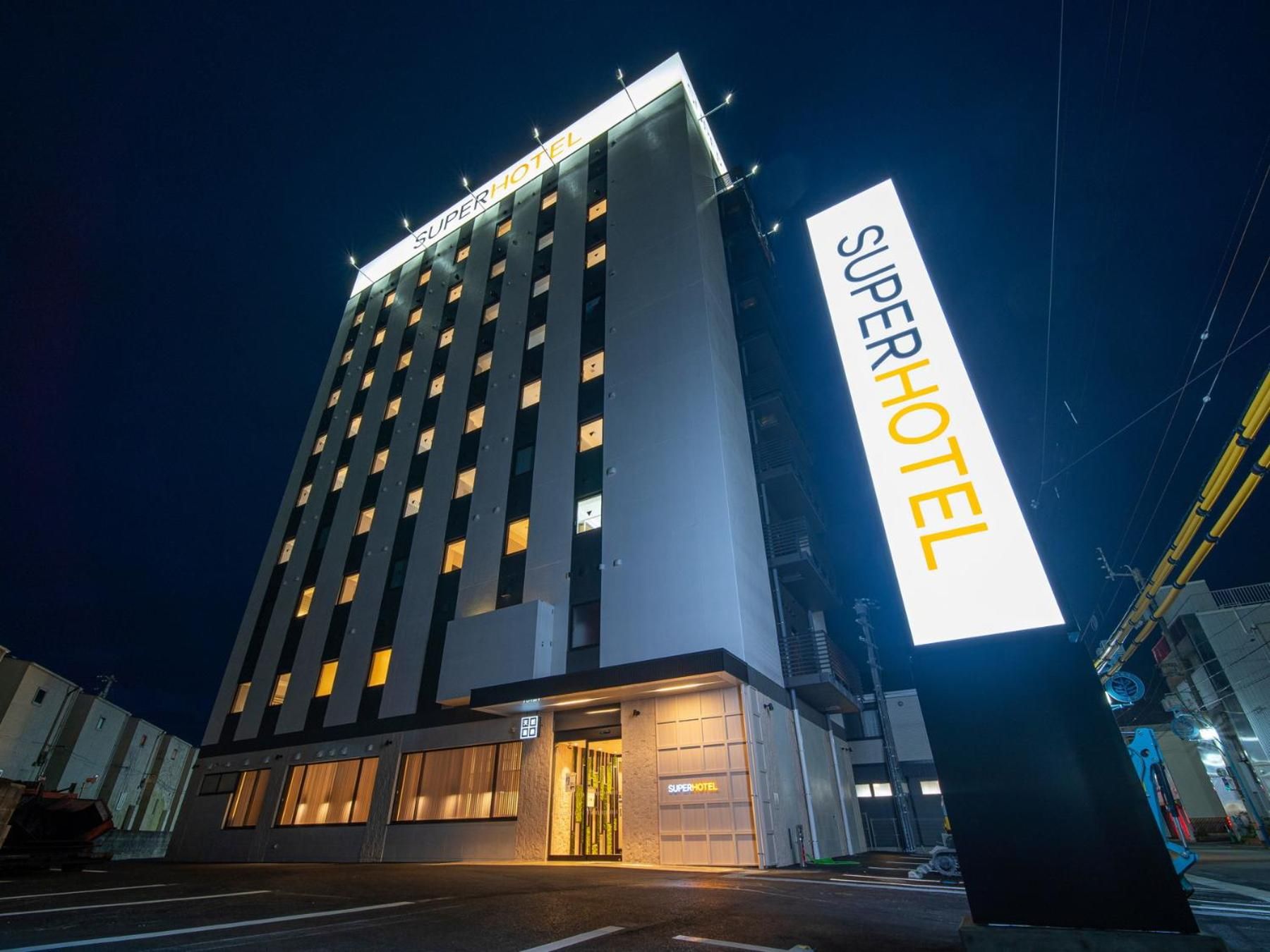 A multi-story hotel with a prominent 'SuperHotel' sign.