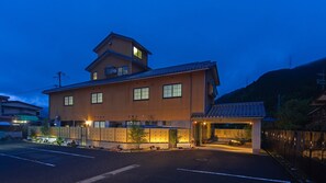 A traditional Japanese building with multiple windows and a small tower-like structure. - Ryokan Kozyo (Yabu)