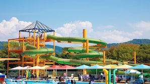 A water park with multiple slides and a pool area. - Wellpia Iyo (Iyo)