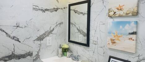 Shower, hair dryer, towels, soap