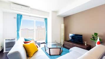 Apartment, Non Smoking | Living room | Flat-screen TV