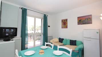 Classic Apartment | Living area | 20-inch flat-screen TV with satellite channels, TV