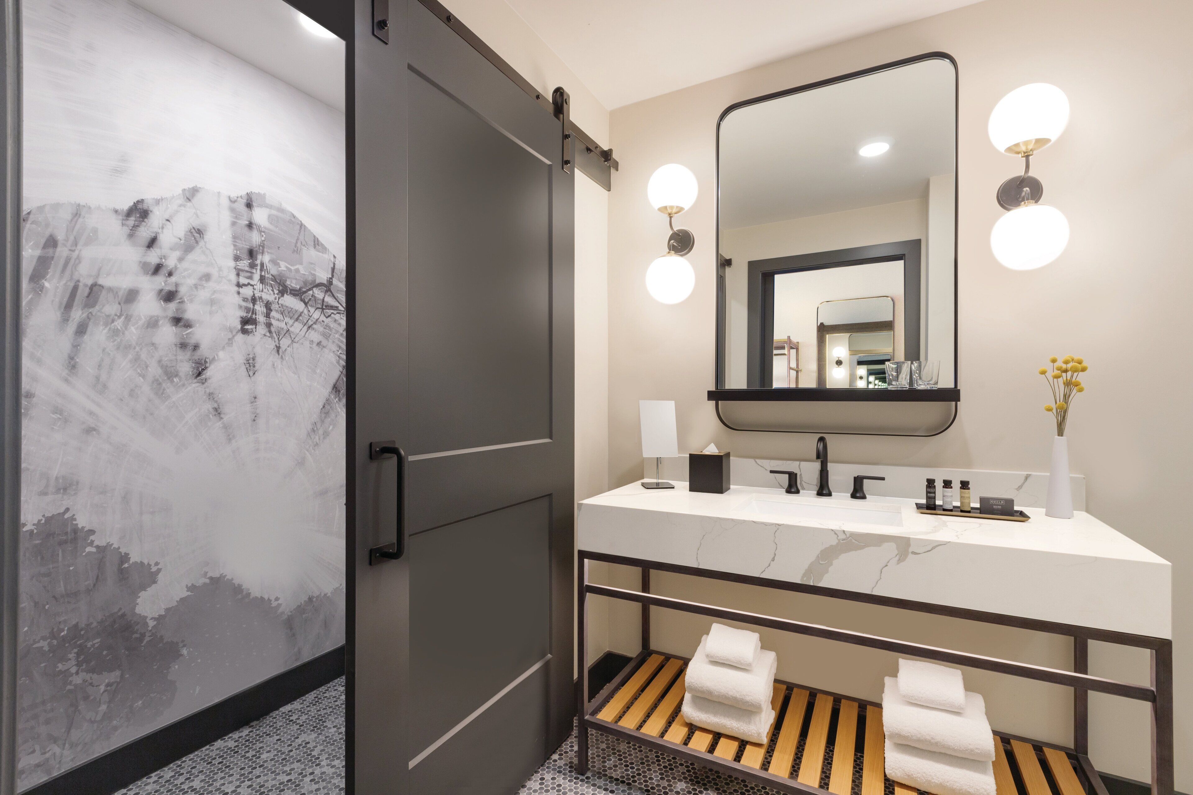 designer toiletries, hair dryer, bathrobes, slippers