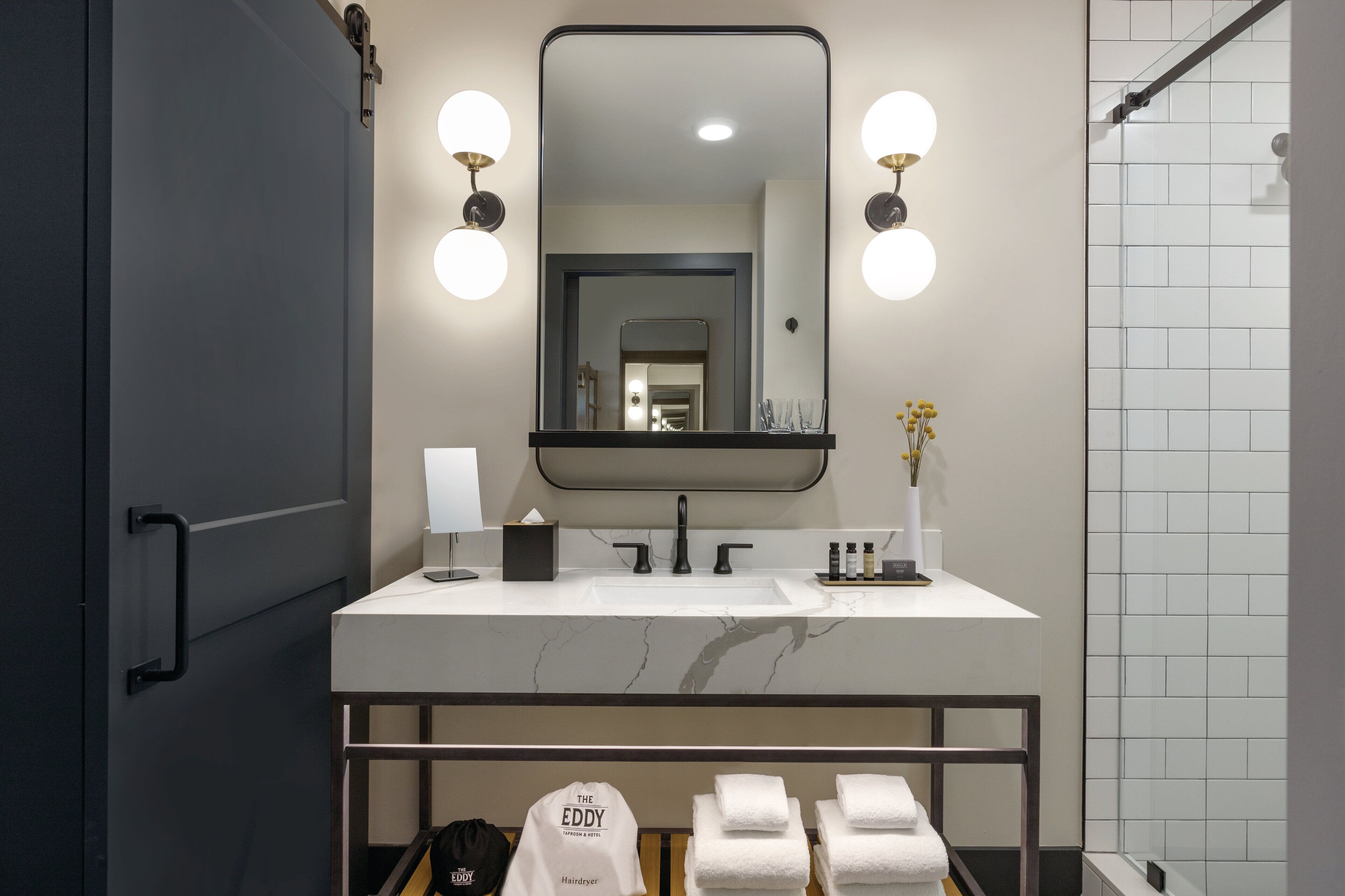 designer toiletries, hair dryer, bathrobes, slippers