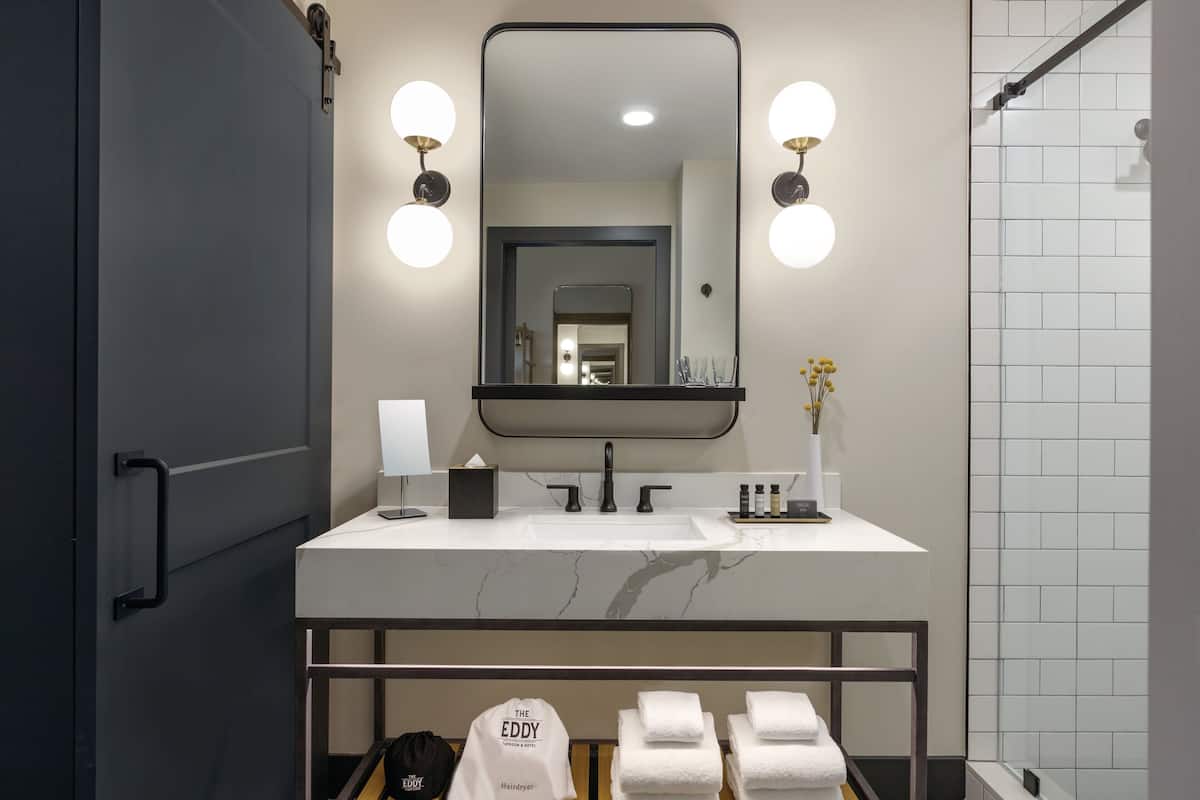 designer toiletries, hair dryer, bathrobes, slippers