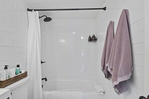 Combined shower/tub, hair dryer, towels, soap