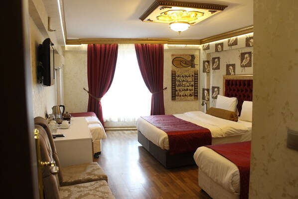 A hotel room with two beds, a desk, and a chair. - Marmara Deluxe Hotel (Istanbul)
