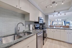 Fridge, microwave, stovetop, dishwasher - Villa Madeira 502 – Gulf-Front Serenity with Heated Pool, Beach Access & Walk to John's Pass (Madeira Beach)