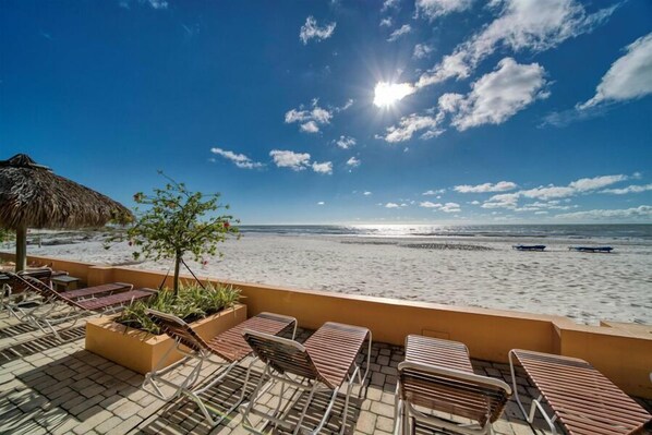 On the beach, sun-loungers - Villa Madeira 502 – Gulf-Front Serenity with Heated Pool, Beach Access & Walk to John's Pass (Madeira Beach)