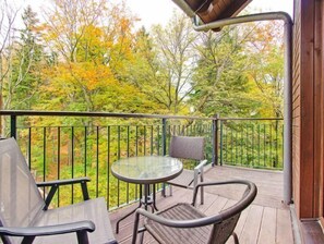 Enjoy a peaceful moment on the deck overlooking the forest, where you can sit and take in the surroundings.