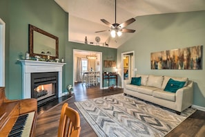 Relax in style with a piano, fireplace, and comfortable seating area.