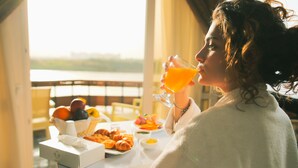 A breakfast setting with a table, a glass of orange juice, and various food items. - Jewel Maadi Cabins and Club (Cairo)