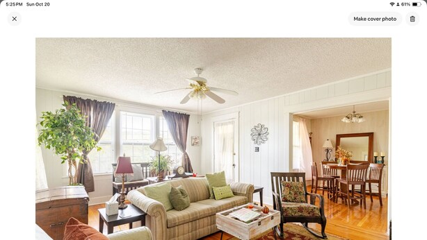 A living room with a sofa, coffee table, and a dining area with chairs and a table. - Cozy confortable (Pulaski)
