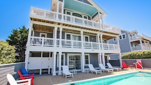 A multi-story building with a pool, balconies, and outdoor seating. - Oceanside, Private Pool, Community Amenities, Hot Tub, VOH94, Knot A Problem (Corolla)