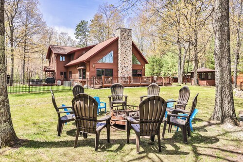 Large lakeside home with hot tub, gazebo, dock, firepit, and fenced in yard!