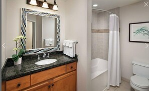 Bathtub, towels, soap, shampoo