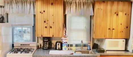 Microwave, coffee/tea maker, cookware/dishes/utensils