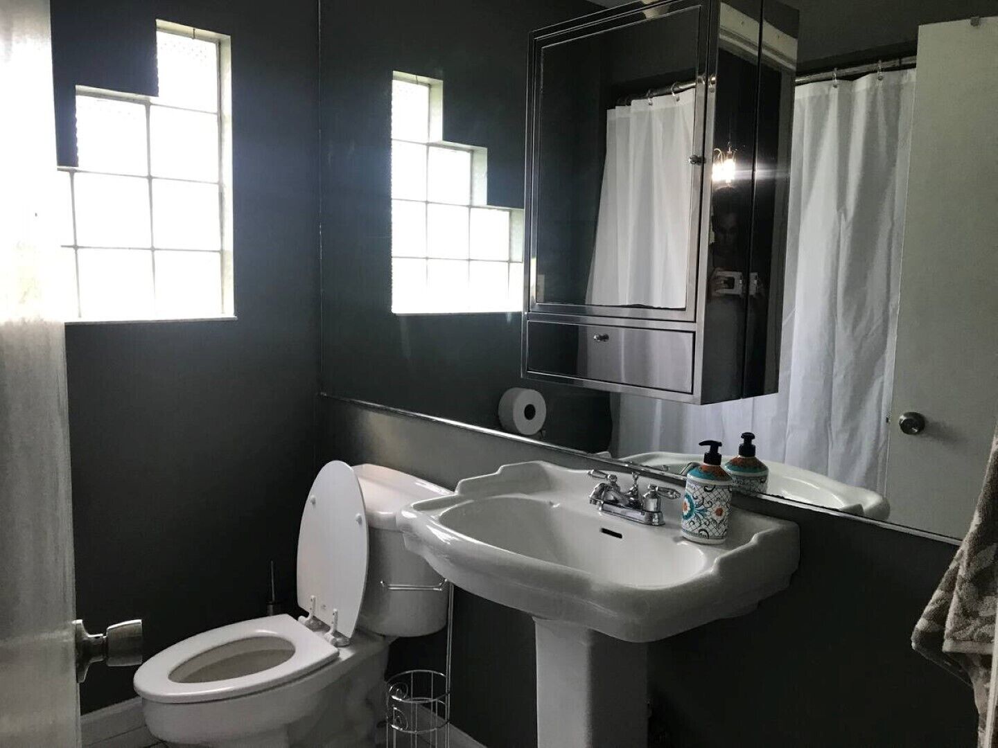 Combined shower/bathtub, hair dryer, towels, toilet paper