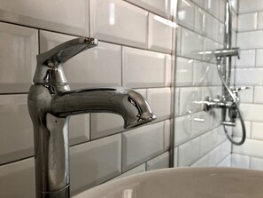 Bathtub, hair dryer, towels, soap