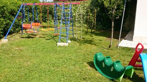 Children’s area - Apartments in Lopar (island Rab) near sandy beach, sea view, quiet location, garden, parking lot. (Lopar)