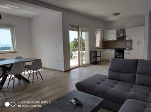 Living area - Apartments in Lopar (island Rab) near sandy beach, sea view, quiet location, garden, parking lot. (Lopar)