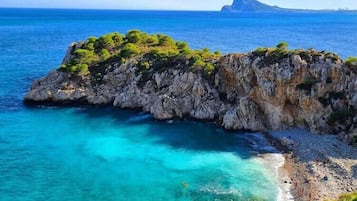 On the beach, sun-loungers