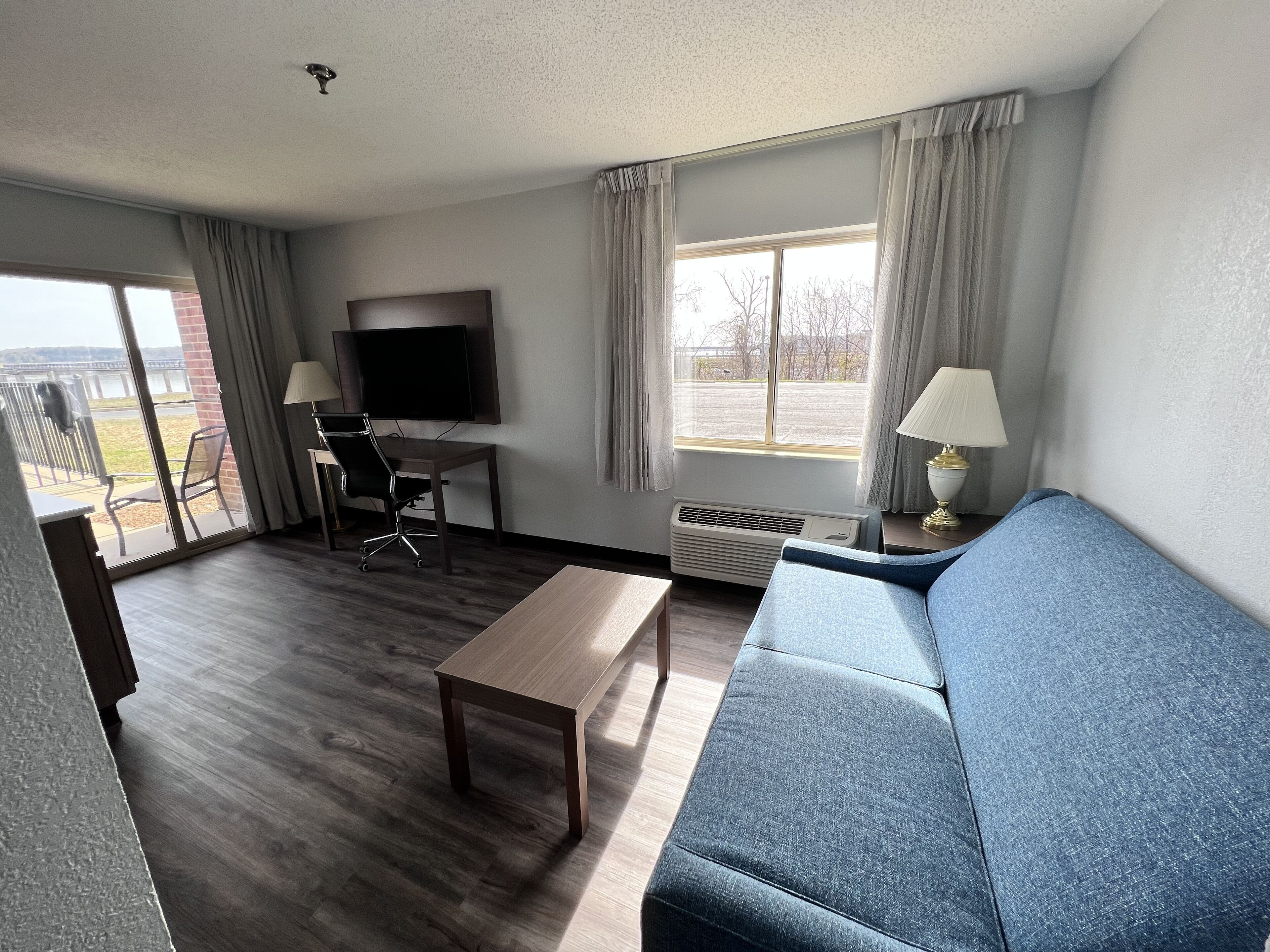 suite, 1 king bed with sofa bed, balcony, lake view (non smoking) | living area | 32-inch led tv with satellite channels, tv