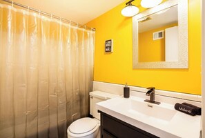 Combined shower/bathtub, hair dryer, towels, toilet paper