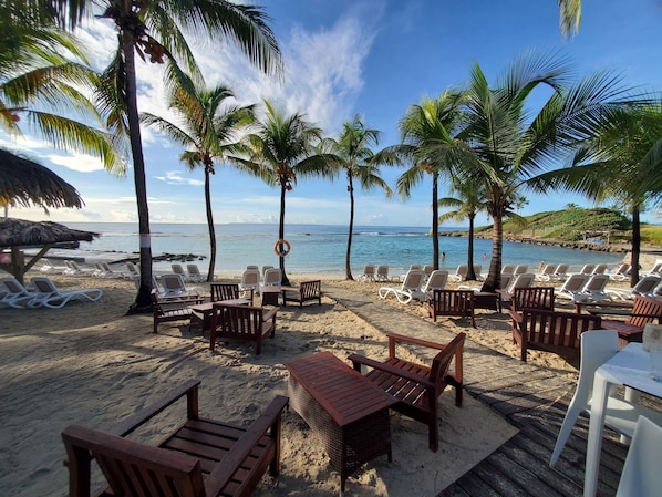 On the beach, sun loungers