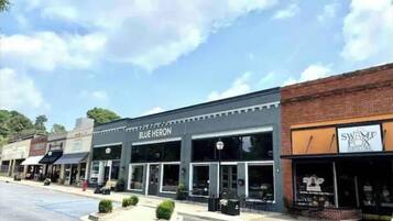 A street view with storefronts including 'Blue Heron' and 'Swamp Fox'.