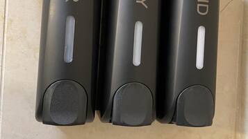 Bathtub, hair dryer, towels, soap