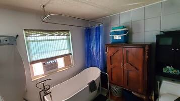 Combined shower/bathtub, hair dryer, towels, soap