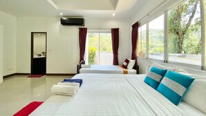 A modern hotel room with two beds, a large window with curtains, a mirror, and a ceiling fan. - 4 Br Private Pool Villa GA (Chalong)