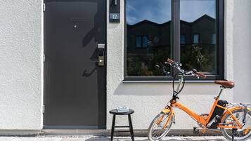 A modern building with a black door and a window.